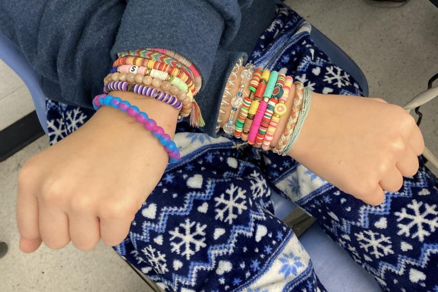 Student Violet Z. shows off her bracelets.